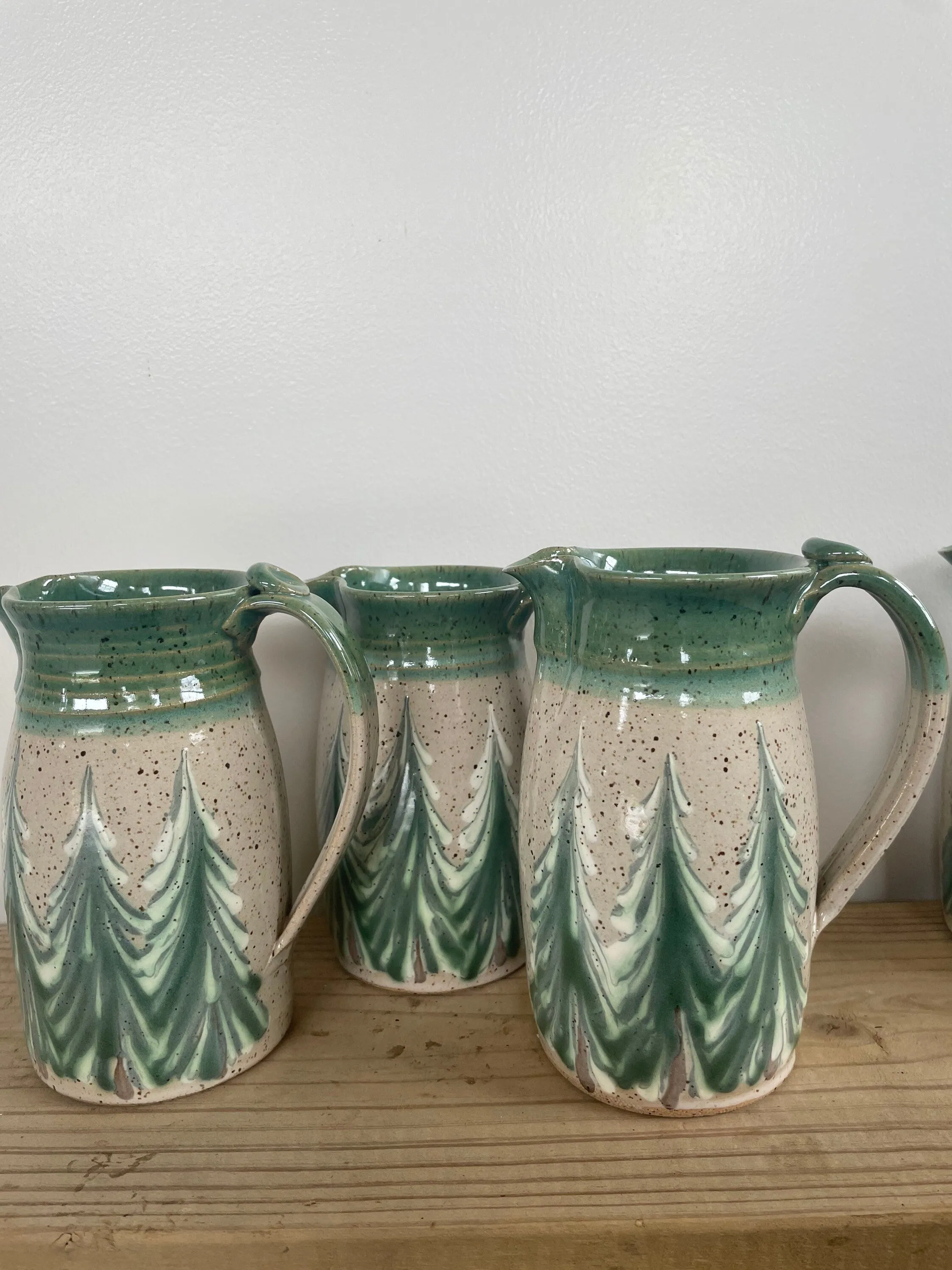 Hand thrown ceramic pitcher with winter trees