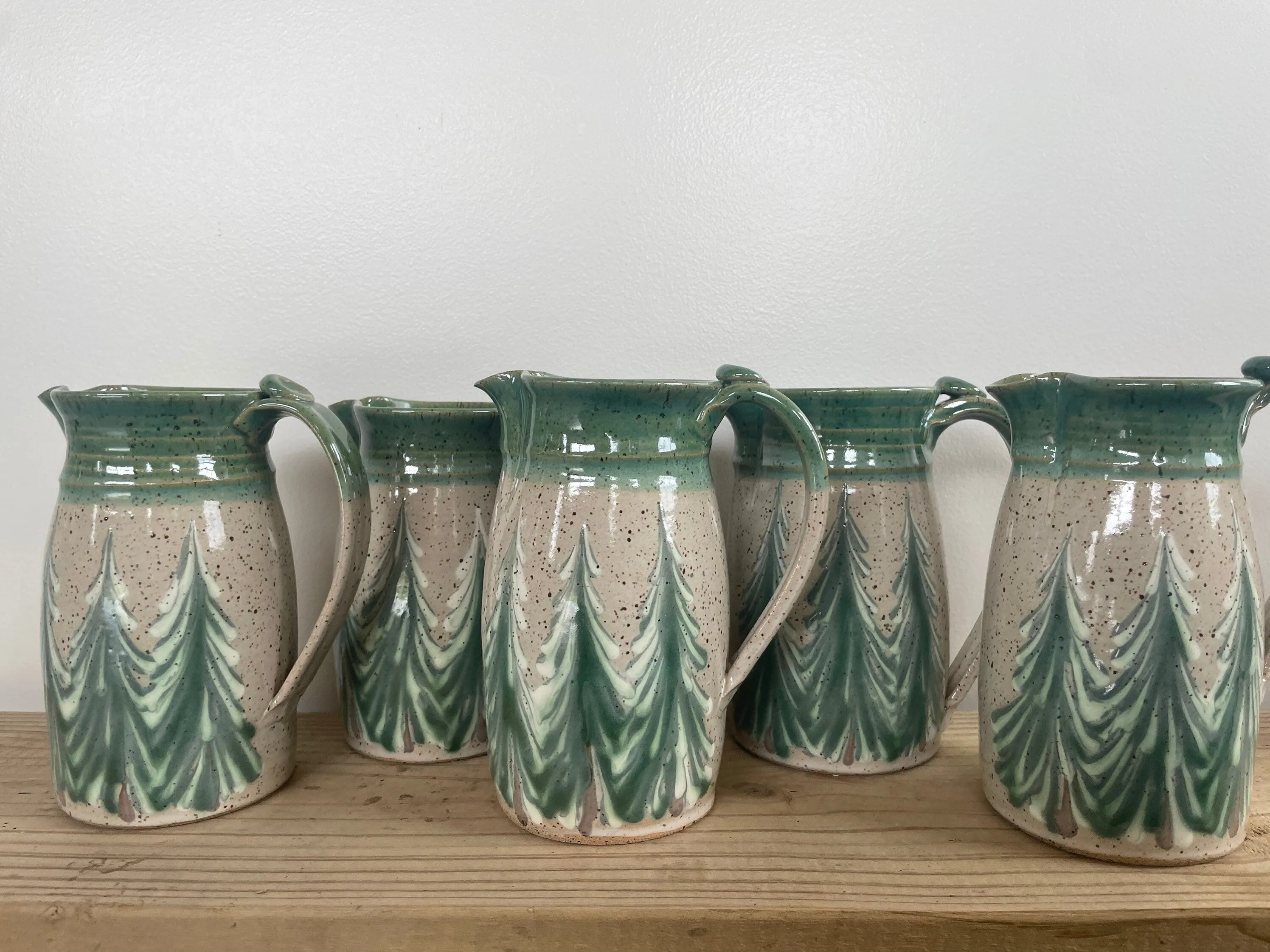 Hand thrown ceramic pitcher with winter trees